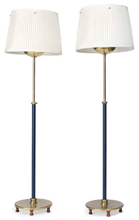 A pair of Josef Frank brass, partly lacquered in blue, floor lamps, Firma Svenskt Tenn.