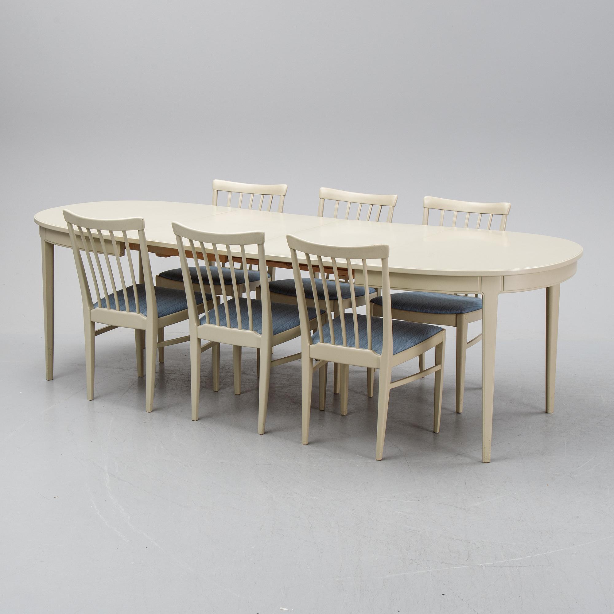 A dining table with six chairs by Carl Malmsten, second half of the 20th Century.