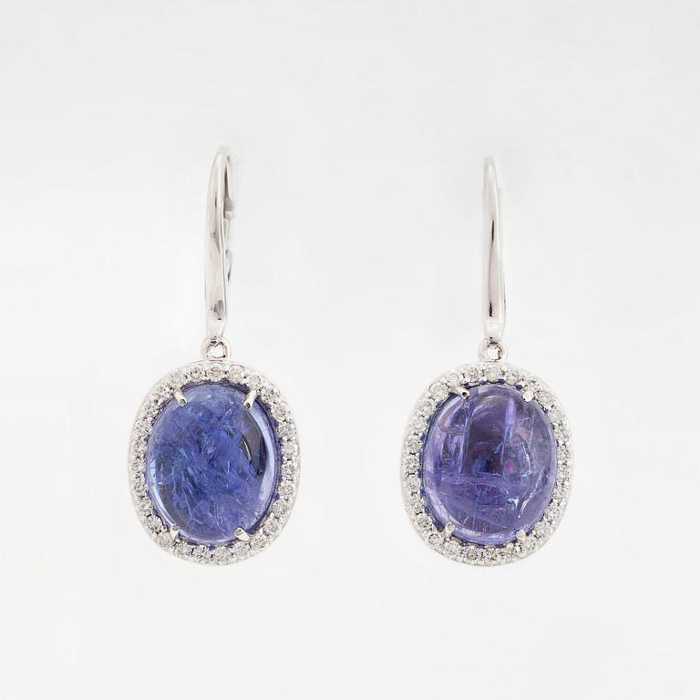 Cabochon-cut tanzanites and diamond earrings.