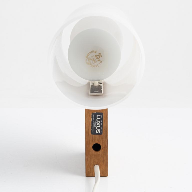 Uno & Östen Kristiansson, a wall light and a table light, Luxus, Vittsjö, Sweden.