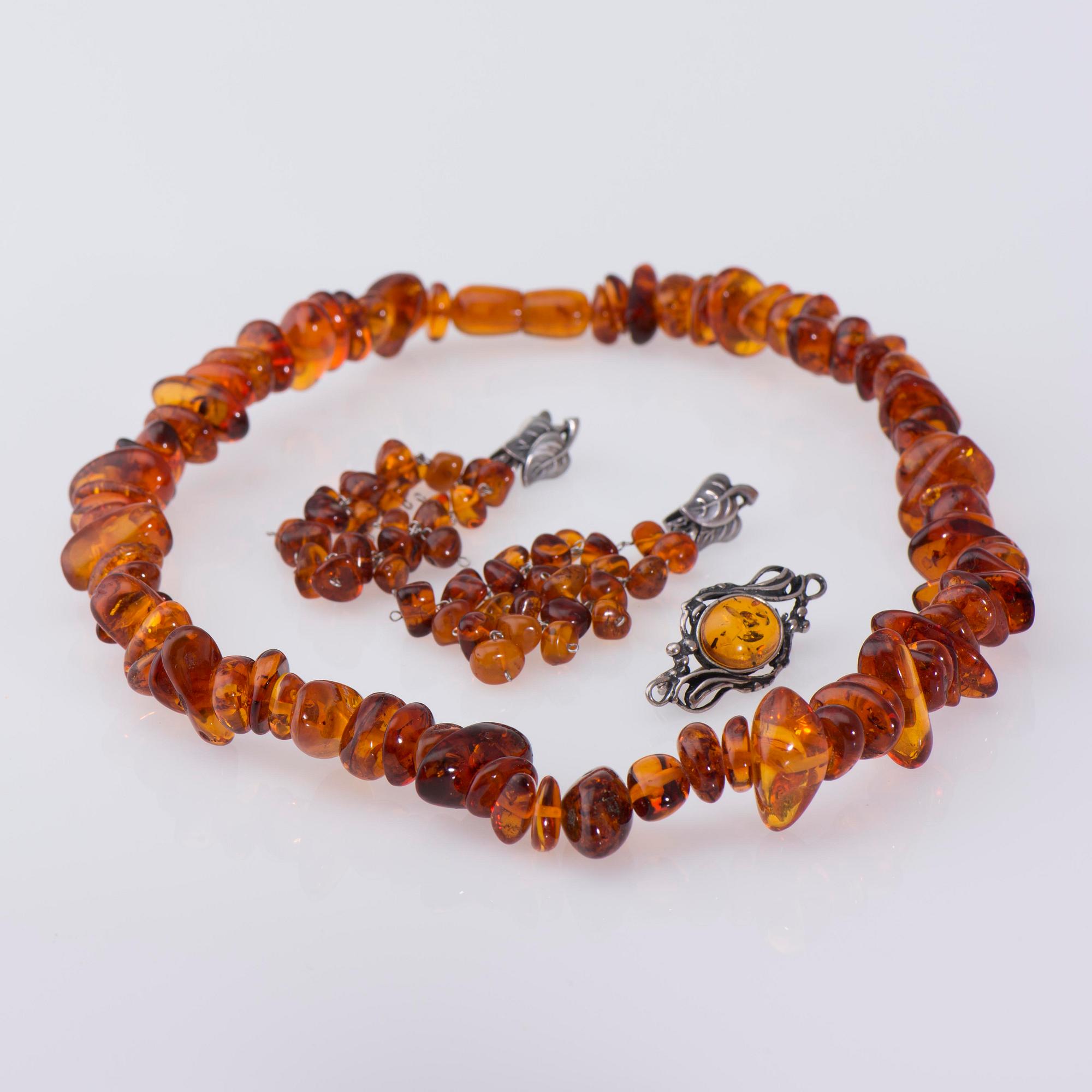 SMYCKESSET, 4 delar, bärnsten och silver, 1900-tal.