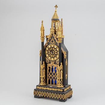 A gothic revival mantel clock.