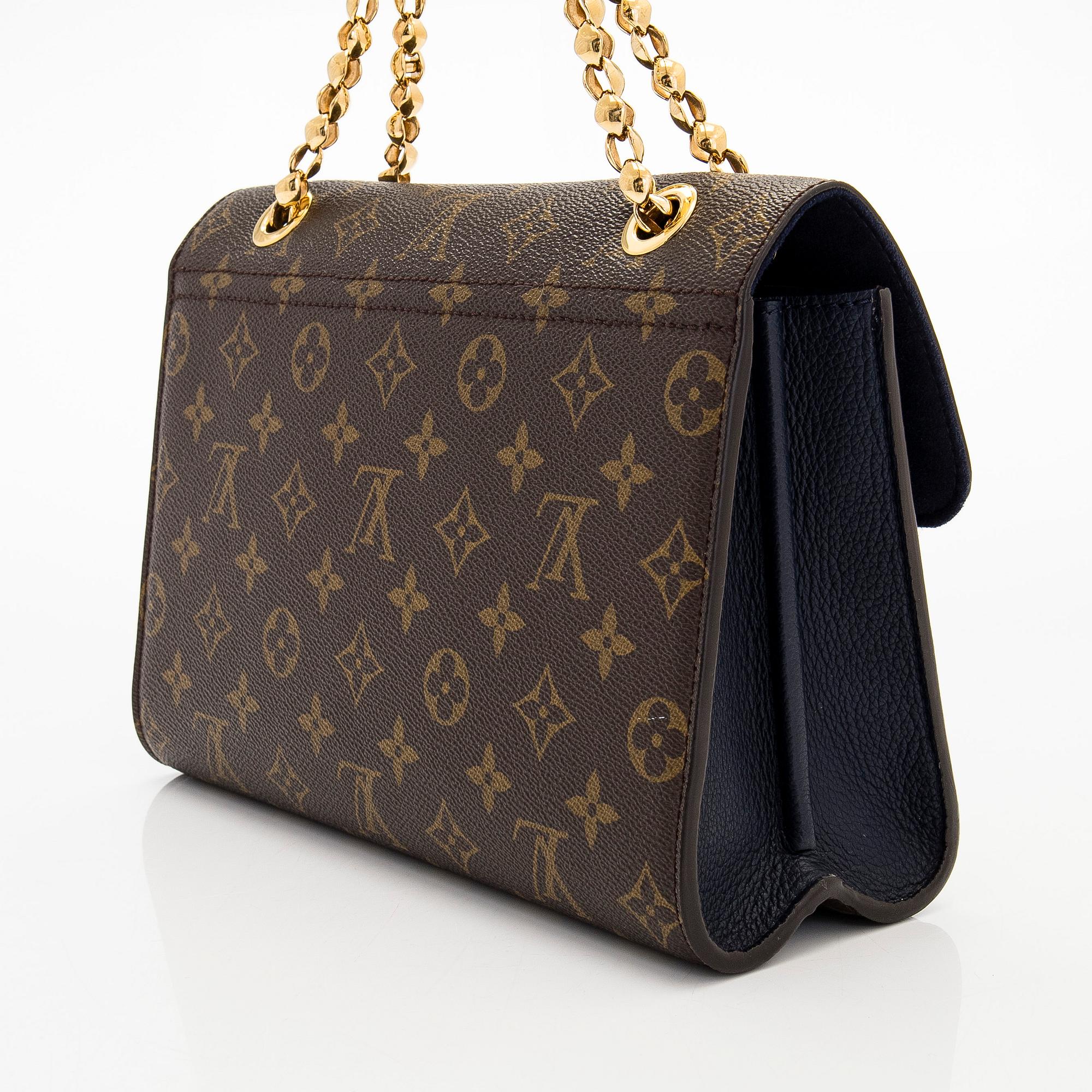 Louis Vuitton, a Monogram 'Victoire' bag.