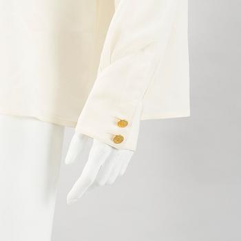 A Crepe de Chine Cream Coloured Silk Blouse by Chanel.