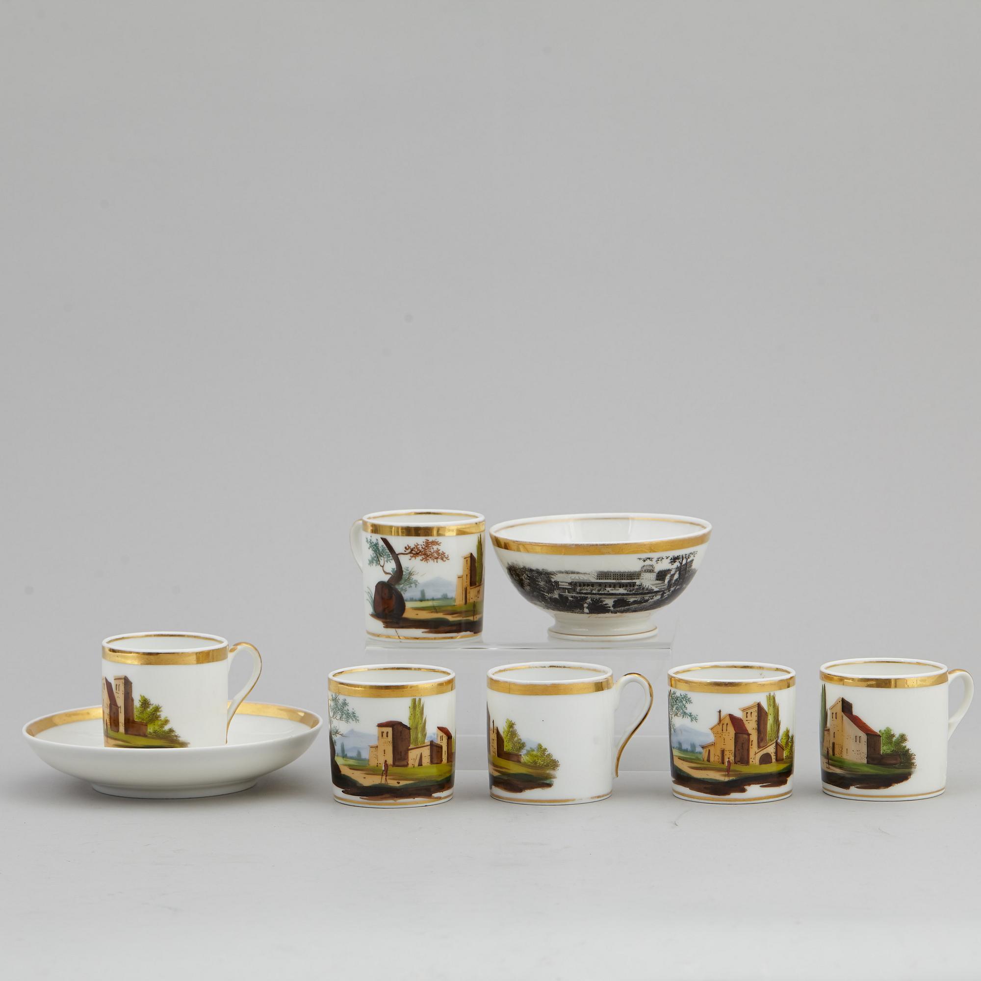 A group of seven cups, one with dish, Germany and France, 19th century.