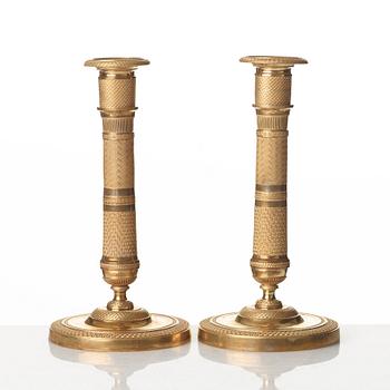 A pair of French Empire candlesticks, early 19th century.