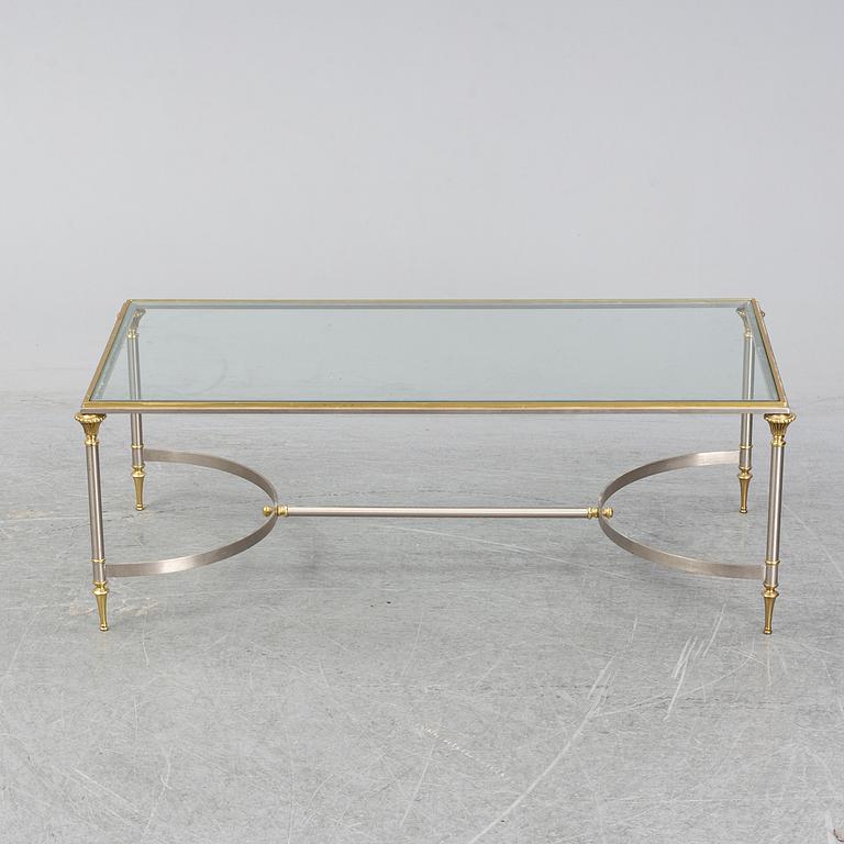 A 1970s sofa table, brass and glass.