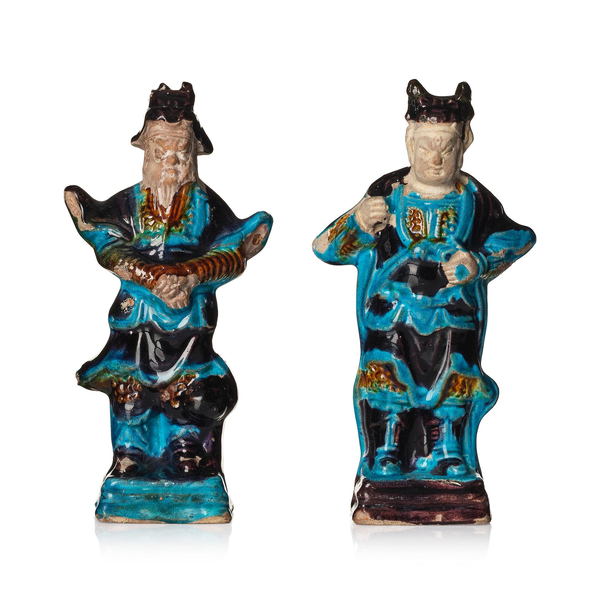 A pair of turquoise and purple glazed figures of guardsmen, Ming dynasty (1368-1644).
