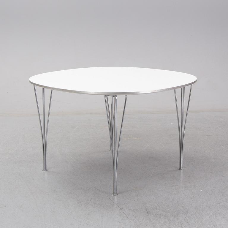 A 'Supercircle table by Bbruno Marthsson & Piet Hein for Fritz Hansen, dated 2000.