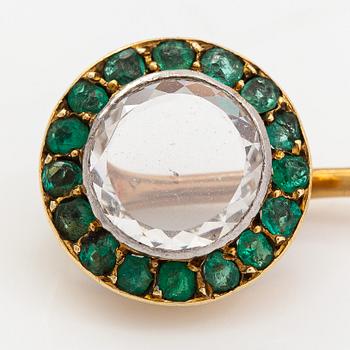An 18K gold tiepin with a diamond ca 0.91ct and emeralds.