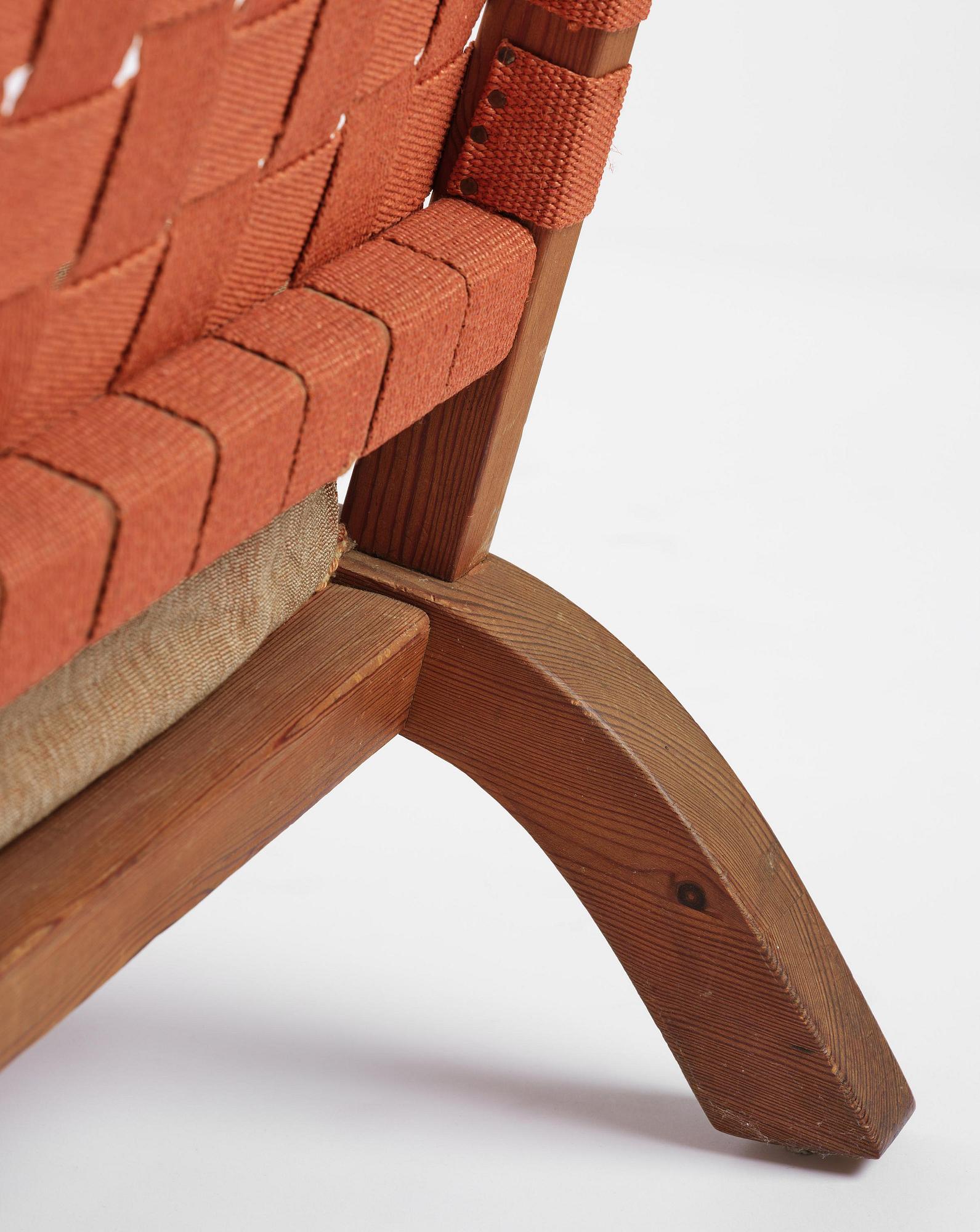 Axel Einar Hjorth, a pair of stained pine "Väddö" easy chairs, Nordiska Kompaniet, Sweden, 1930s-40s.