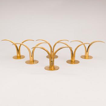 Six brass candle sticks "Liljan" by Ivar Ålenius-Björk for Ystad metall, second half of the 20th century.