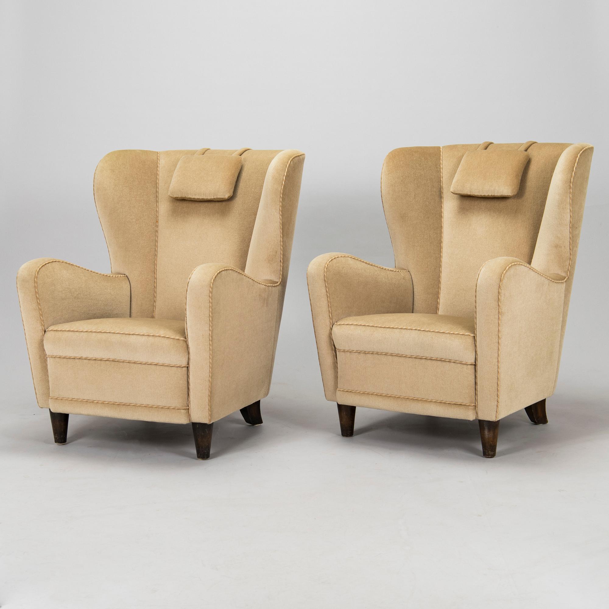 A pair of mid-20th century armchairs.