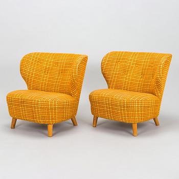 A pair of mid-20th century armchairs.