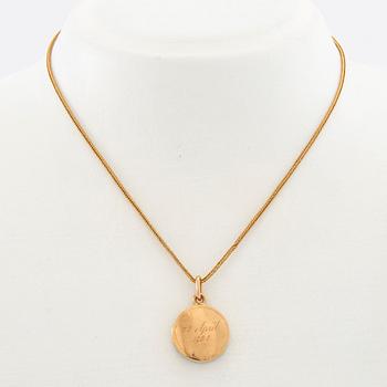 Halsband 18K guld med berlock.