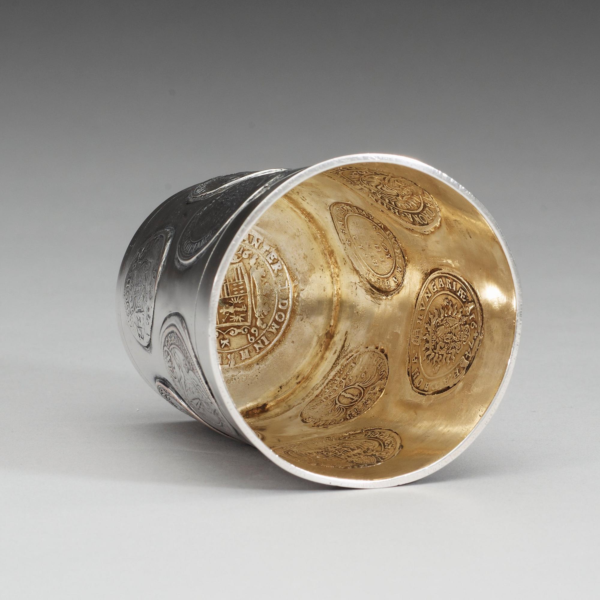 A Austrian-Hungarian early 18th century parcel-gilt beaker, unmarked.