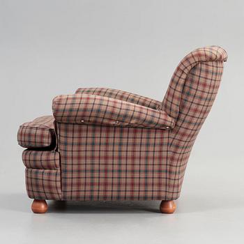 Josef Frank, a 'model 336' armchair, by Svenskt Tenn, Sweden.