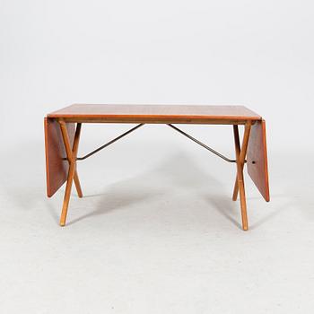A Hans J Wegner "Savbukkebordet AT-303", teak and oak drop-leaf dining table, Andreas Tuck, Denmark 1950s-1960s.