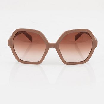 Prada, a pair of coral pink sunglasses.