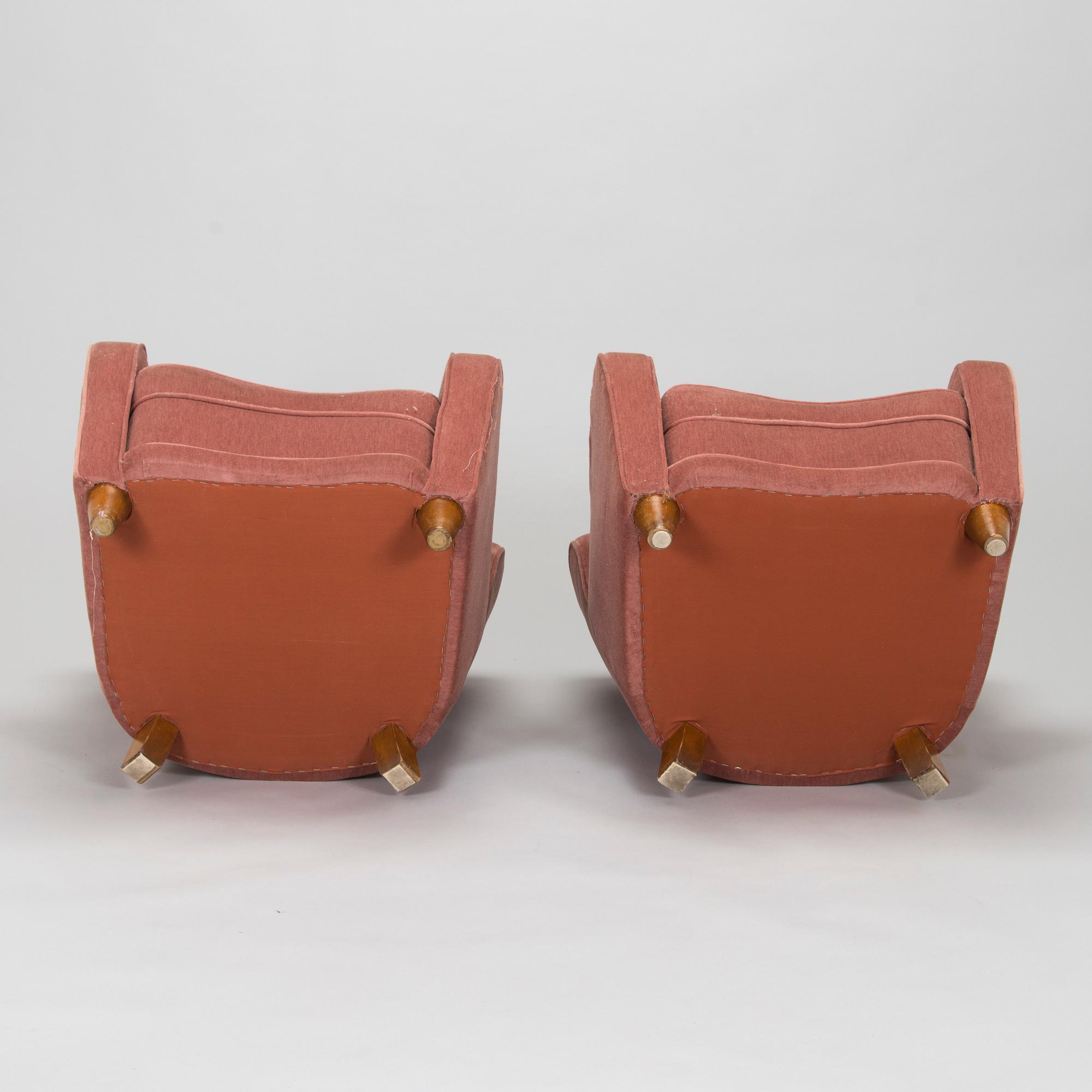 A pair of mid-20th century armchairs.