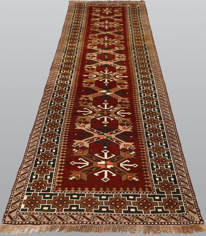 A semi-antique Anatolian carpet, c. 390 x 94 cm.