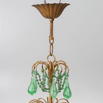 A chandelier, likely from Italy, circa 1950.