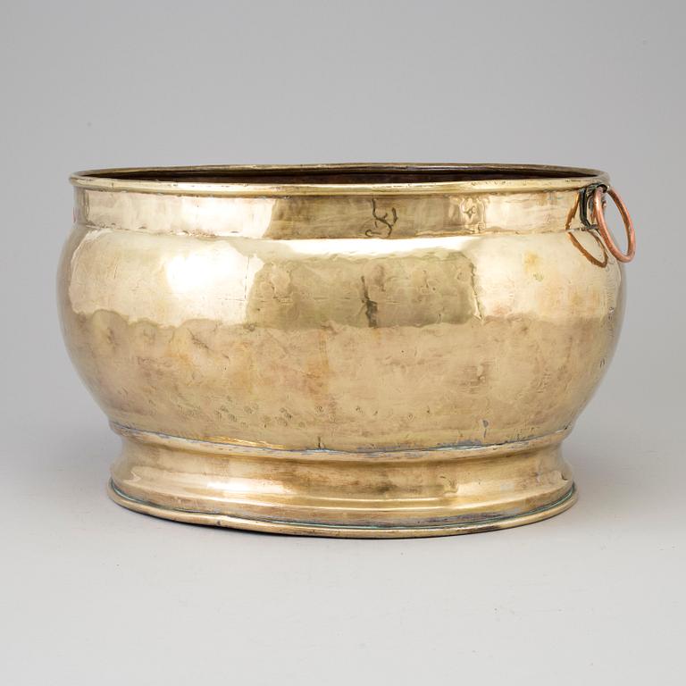 A 18th century brass champagne cooler.