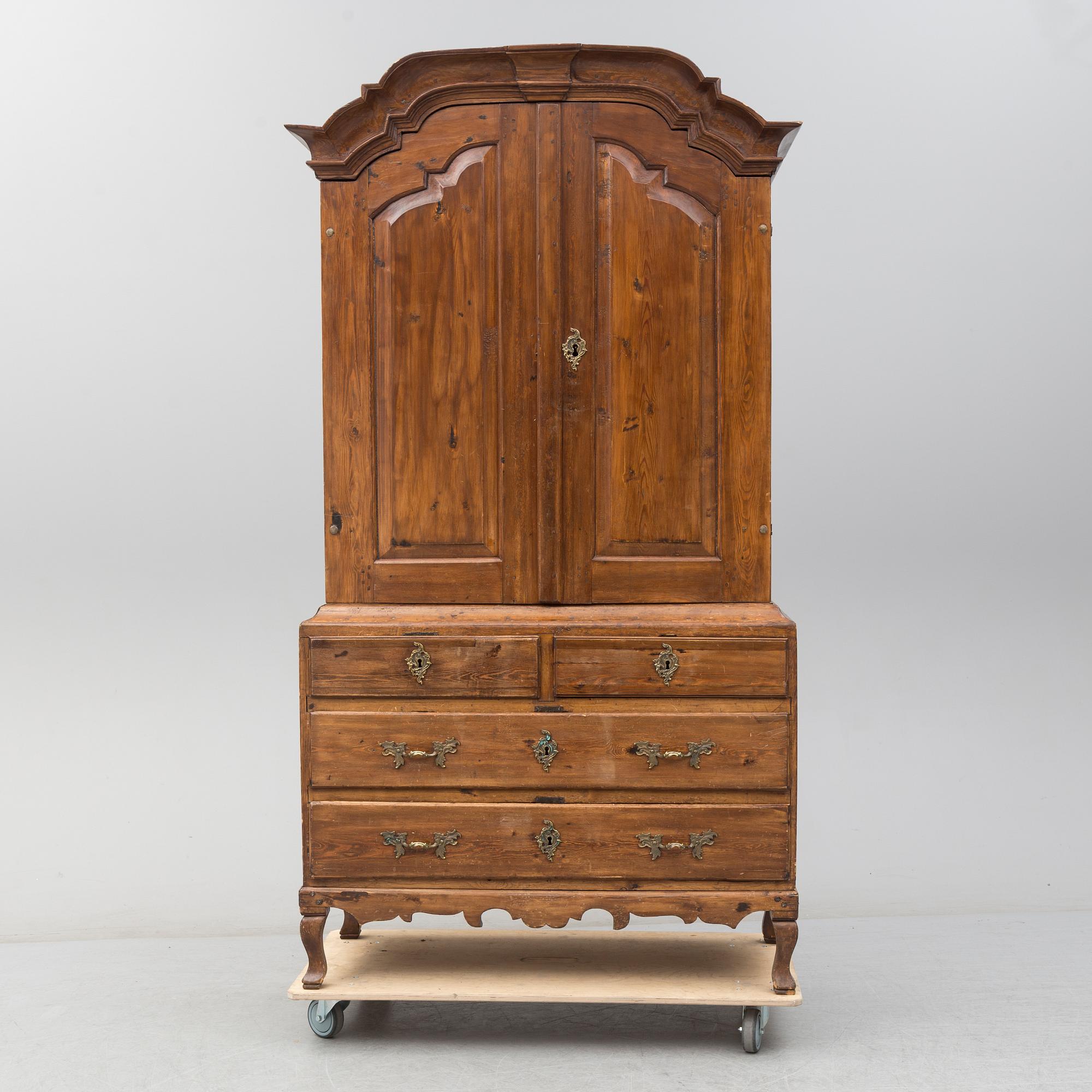 a 1700's Rococo pine cabinet.