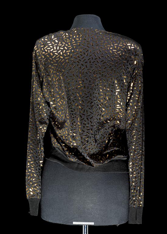 A blouse by Yves Saint Laurent.