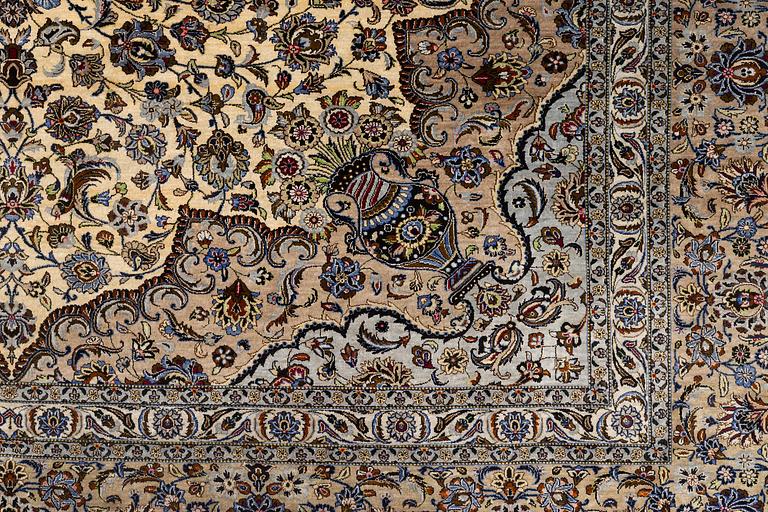 A semi-antique silk Keshan carpet, c. 350 x 248 cm.