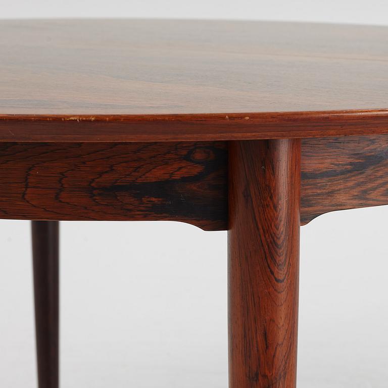 Niles Otto Møller, a rosewood veneered table with four chairs, JL Møller, Denmark, 1950's/60's.