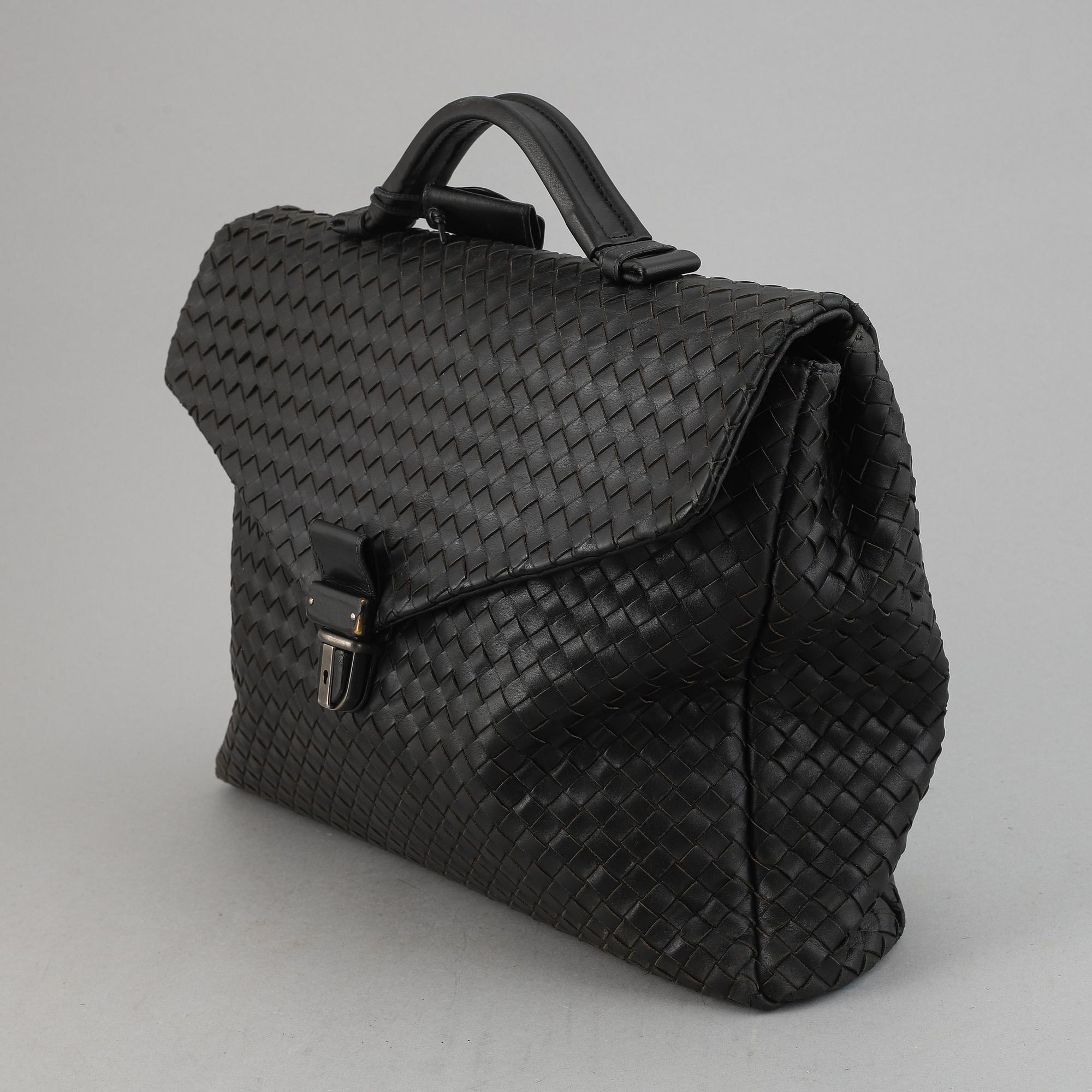 Bottega Veneta, a black intrecciato leather briefcase.