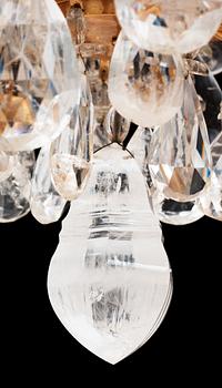 A late Baroque-style circa 1900 rock crystal twelve-light chandelier.
