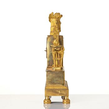A French Empire ormolu figural mantel clock, early 19th century.