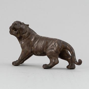 A Japanese bronze okimono in the shape of a tiger, Meiji period (1868-1912), late 19th century. Signed 'Mitani'.