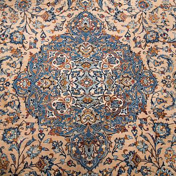 A carpet from Mashad, around 381 x 297 cm.
