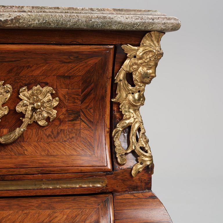 A Swedish early rococo parquetry, ormolu-mounted and marble commode, presumably by S. Pasch or J. Wulf , ca. 1740.