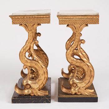 A matched pair of Swedish Empire console tables, first half of the 19th century.