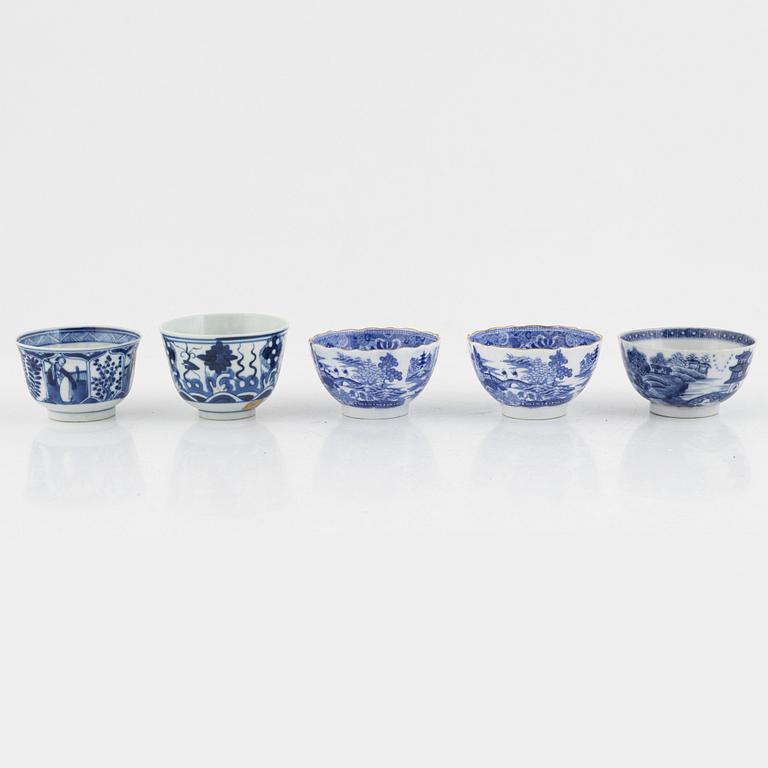 A group of thirteen cups, a bowl and a cup holder, four saucers, partly China and 18th century,