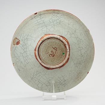 A Toini Muona stoneware charger, Arabia, Finland.