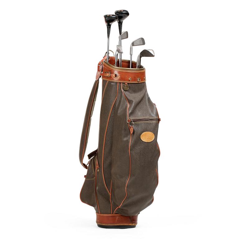 MULBERRY, a green leather golf bag with golf clubs.