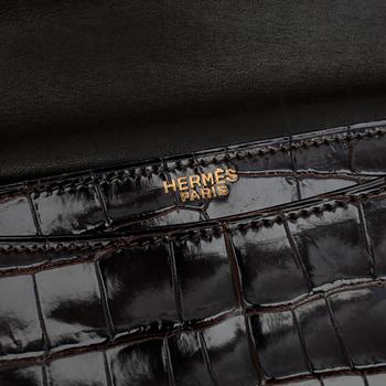 HERMÈS, a brown crocodile leather handbag.