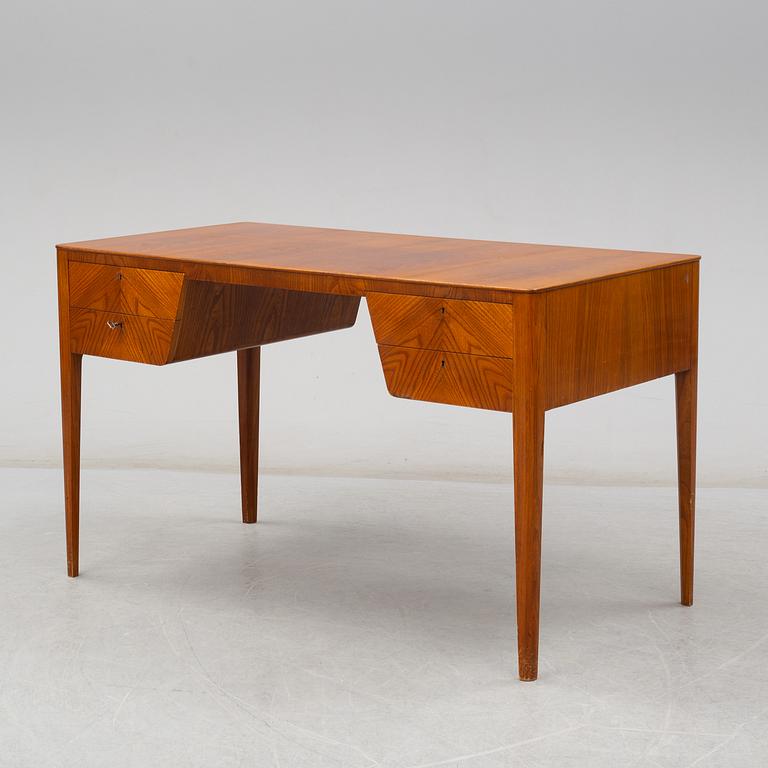 A mid 20th century elm veneered desk.