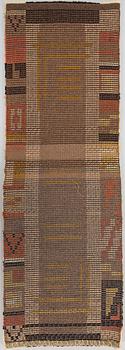 A 1930's Finnish long pile rug. Ca 140x47 cm.