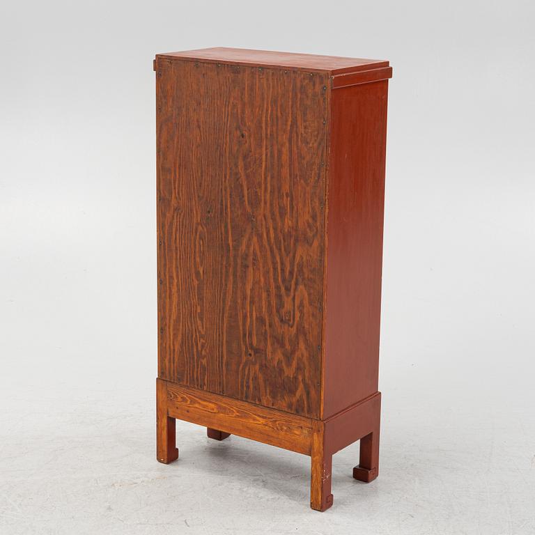 A Chinese cabinet, early 20th Century, with 19th Century carved panels.