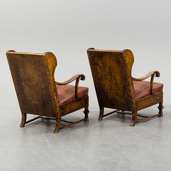 A pair of 1920s easy chairs.