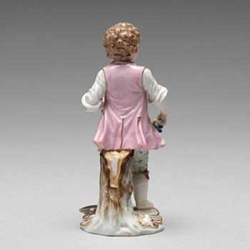 A Meissen figure of a young boy with grapes, 1890's.