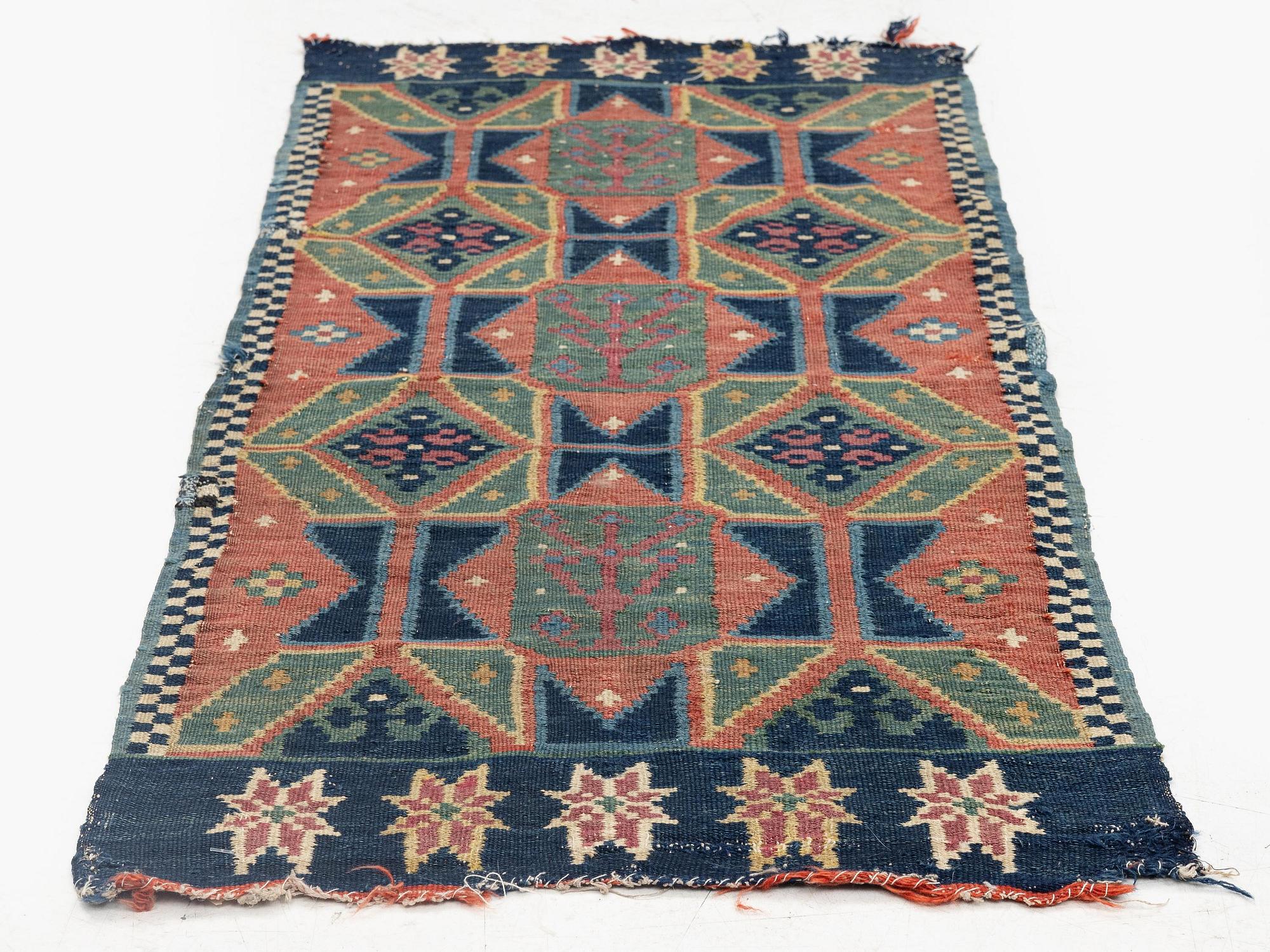 A carriage cushion, double-interlocked tapestry, c. 102 x 48 cm, Scania, Sweden, last quarter of the 18th century.