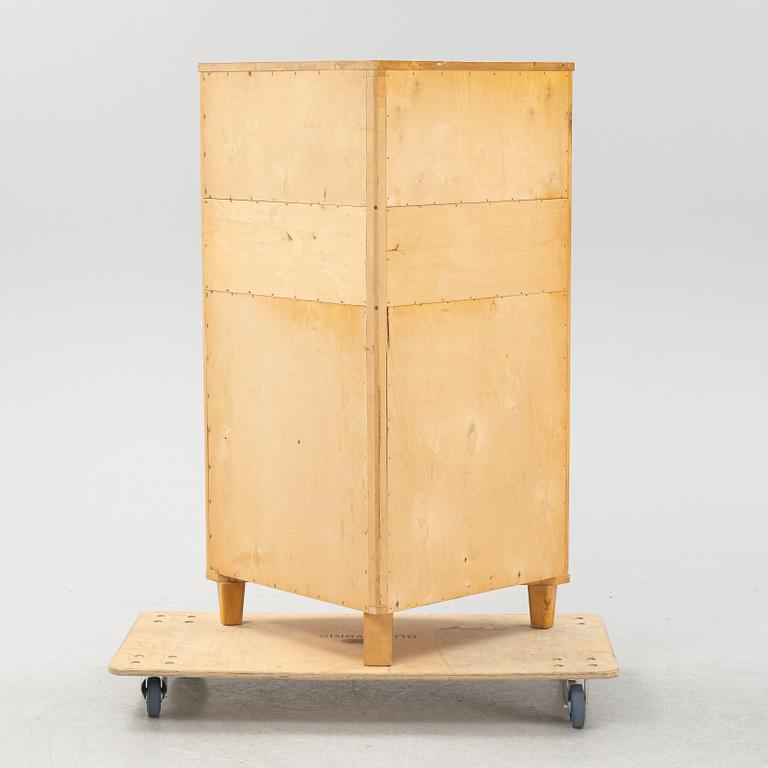 A Swedish Modern corner cabinet, 1940s.