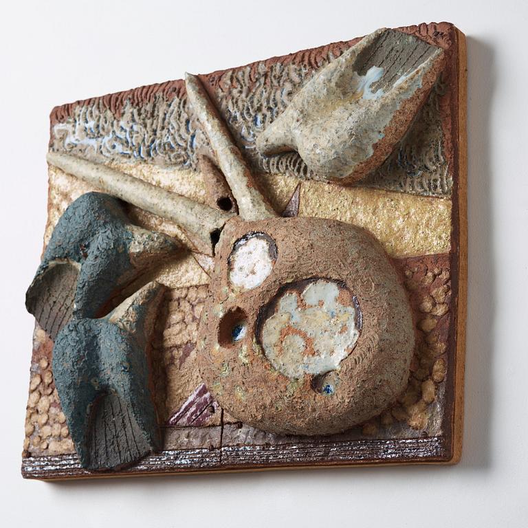 Tyra Lundgren, a stoneware relief 'Reclining pecock dove', Sweden 1950-60's.